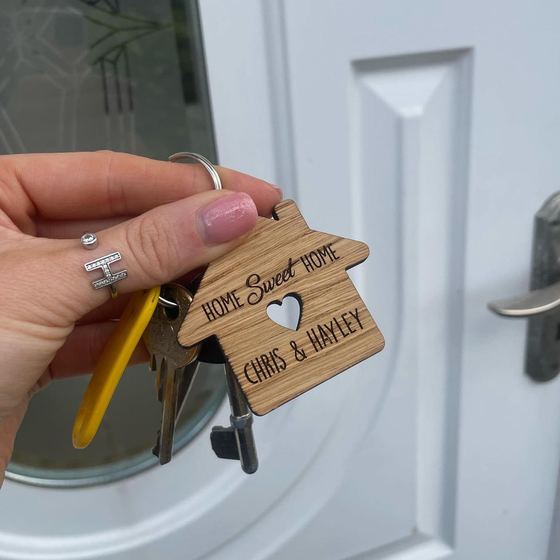 A personalised house keyring on a set of new front door keys